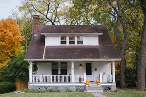 White house with a brown roof. 
