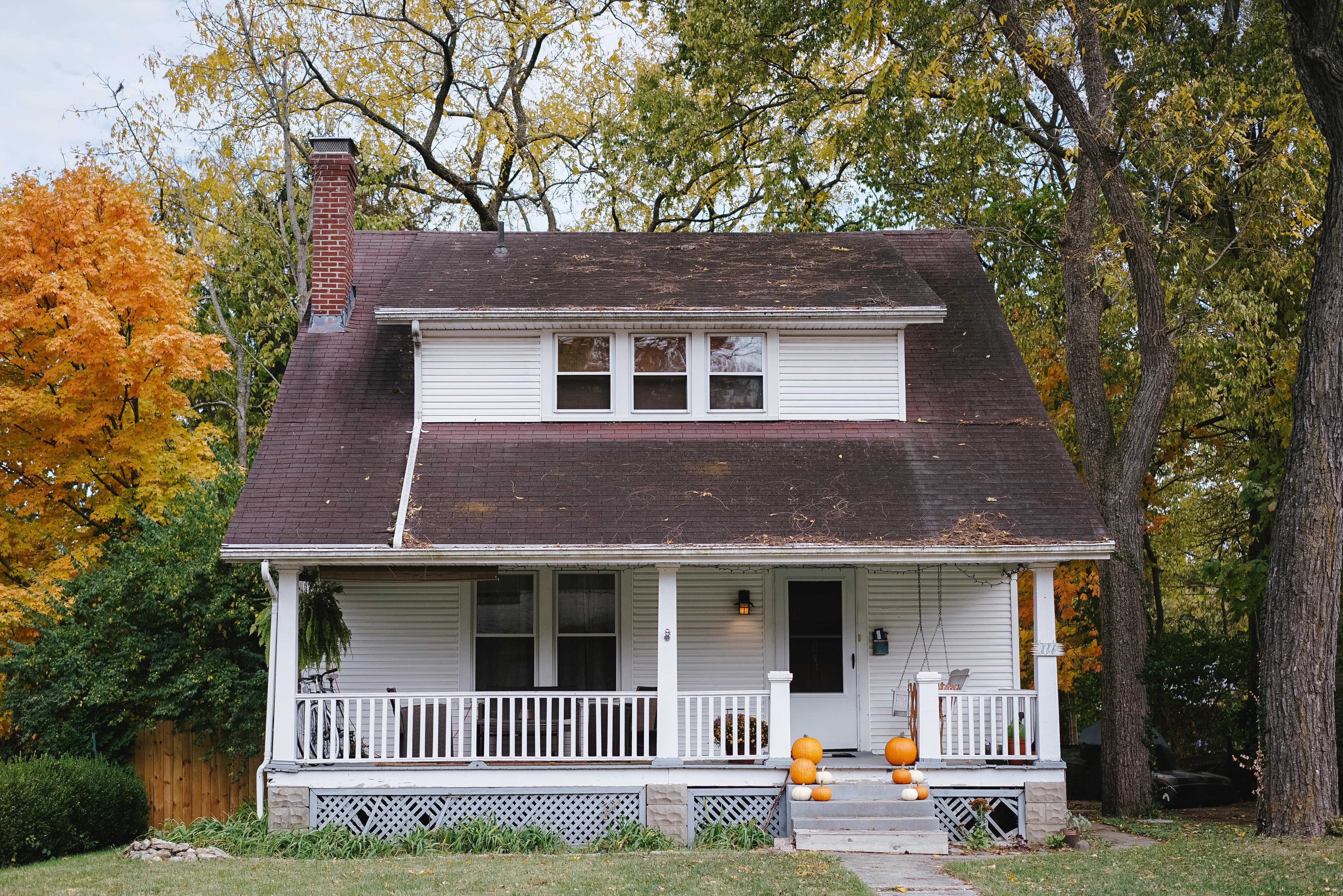 White house with a brown roof. 
